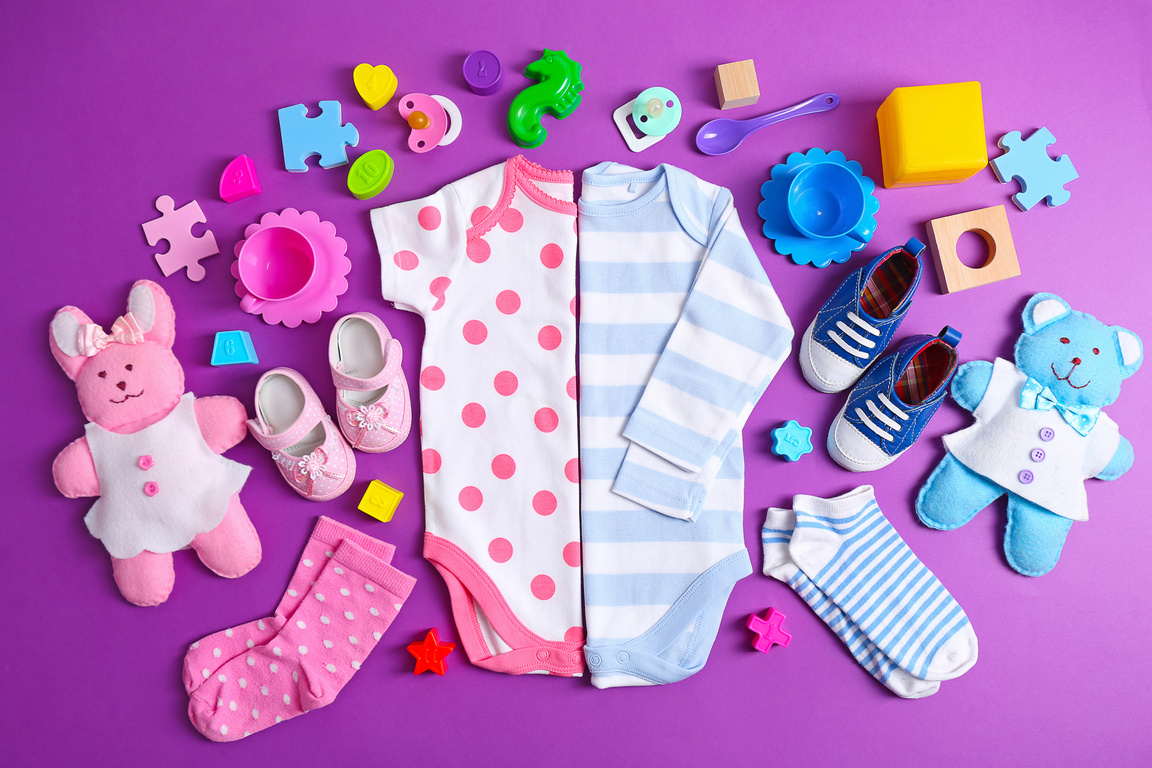 Kid's Clothing and Toys on Purple Background 